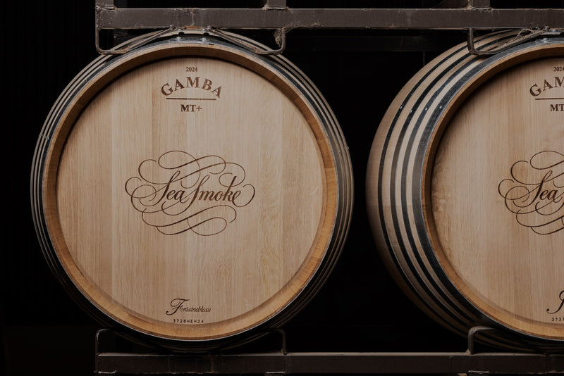 Oak barrels with the Sea Smoke logo on them